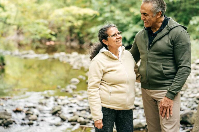 These 3 Canadian Dividend Stocks Are Great for Retirees Two seniors walk in the forest