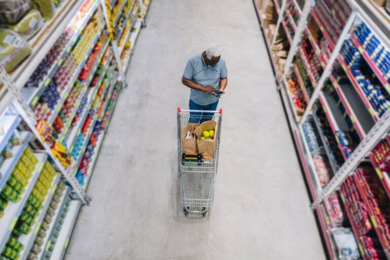 A High Dividend Yield Can Be a Warning Sign: Here’s Why man shops at grocery store