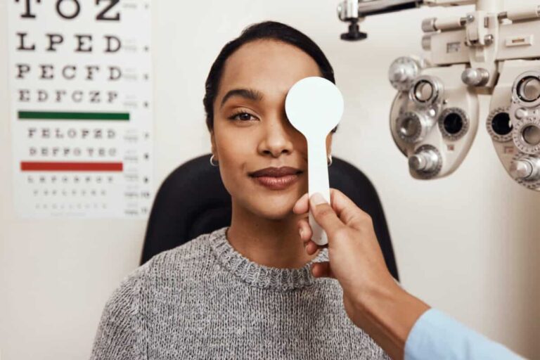 Don’t Make This TFSA Contribution Room Mistake patient tests her eyes with a vision test at a doctor